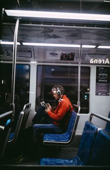 man sitting inside train while reading photo – Free Human Image on Unsplash People On Public Transport, Public Transport Photography, On The Train Aesthetic, People In Public, Bus Drawing, Bus Transportation, Street Photoshoot, Autumn Photoshoot, Train Drawing