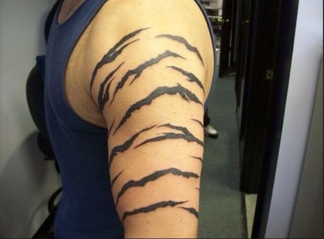 10+ Best Tiger Stripes Tattoo Ideas and Designs | PetPress Tiger Stripes Tattoo, Tiger Print Tattoo, Tiger Stripe Tattoo, Top Forearm Tattoos, Mens Tiger Tattoo, Tattoos Tiger, Stripe Tattoo, Star Tattoo Meaning, Leo Tattoo Designs