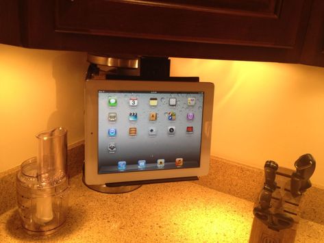 Instructions on making your own by adapting an under cabinet tv mount, this one flips up when not in use Kitchen Ipad Holder, Under Cabinet Tv, Modern Farmhouse Style Living Room, Tv Kitchen, Ipad Mount, Collins Glass, Tv In Kitchen, Dream Kitchen Ideas, Recipe Holder