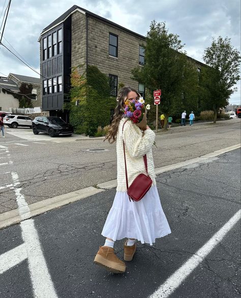 fall maxi skirt outfit rory gilmore sweater platform mini uggs inspo flower boquet brown paper inspo autumn vibes Long Dress And Uggs Outfit, Maxi Skirt And Sweater Outfit Fall, Ugg Spring Outfit, Ugg Tasman Skirt Outfit, Uggs With Skirt Outfit, Ugg And Skirt Outfit, Uggs Dress Outfit, Modest Mini Skirt Outfit, Fall Outfits Maxi Skirt