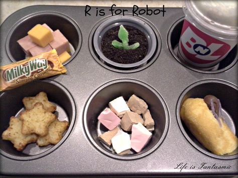 Ham, cheese cubes, pudding dirt cup, Strawberry smoothie, milky way bar, star tots, space ice cream, and twinkie for Wall-E cockroach R Is For Robot, Pudding Dirt, Movie Night Activities, Space Ice Cream, Muffin Tin Meals, Dirt Cup, Wall E Movie, Dirt Pudding, Movie Night Theme