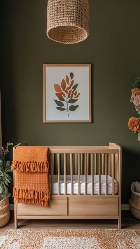 An earthy green nursery with a natural wood crib, orange blanket accents, and woven textures for a warm, inviting feel. Natural Wood Nursery Furniture, Green Nursery Colors, Neutral Nursery Green, Nursery Corner In Parents Room, Green Nursery Ideas, Orange Blanket, Wood Crib, Parents Room, Green Nursery