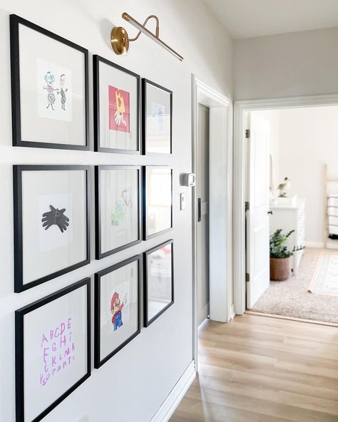 Black square frame art gallery photo gallery wall gold picture light sconce hallway Kids Artwork Wall, Kids Art Display Wall, Blonde Vinyl, Playroom Artwork, Gallery Wall Artwork, Kids Gallery Wall, Beachy Blonde, Art Display Wall, Displaying Kids Artwork