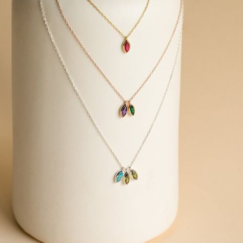 The best way to commemorate everyone in your family is here. Our Custom Marquise Birthstone Necklace allows you to customize the number of gemstones you would like to include everyone you would like to honor. This dainty necklace makes for a great gift for the important mother figures in your life. Material: High Quality Solid 925 Sterling Silver Finish: Sterling Silver ∙ 18K Gold ∙ Rose Gold Personalized: Default design comes with up to 3, ~5 x 2mm Marquise Gemstones SKU: MM-NM127 Necklace With Stone Pendant, Momma Necklace, Birthstones Necklace, Modern Necklace Design, Birthstone Necklaces, Mom Necklace Personalized, Sideways Initial Necklace, Dainty Initial Necklace, Blue Sapphire Pendant