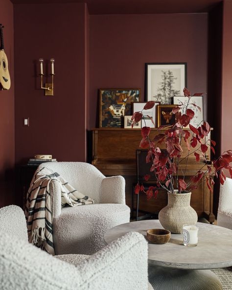 Roses are red, interiors burgundy! Happy Valentine’s Day everyone. How devine is this wall colour by @benjaminmoore called Fading Twilight?! I really wanted to share this beautiful interior by @chrislovesjulia. Just love this very simple design with these beautiful bouclé chairs offering both visual depth and contrast. The vintage feel also makes this space feel so relaxing and inviting. Simply stunning. #interiors#interiorinspo#valentinesdecor#decor#homeinspo#homedecor#bejaminmoore#chr... Burgundy Lounge Living Rooms, Dark Burgundy Wall Paint, Dark Red Feature Wall, Deep Burgundy Wall Paint, Living Room Bordeaux Red, Living Room Red, Event Inspiration, Beautiful Interiors, Wall Colors