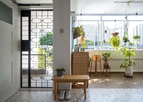 Walk-Up Apartments in Singapore: 5 Charming Homes Where Old Meets New | Qanvast Hdb Interior Design, Hdb Renovation, Hdb Interior, Walk Up Apartment, Creating An Entryway, Monochromatic Aesthetic, Singapore Interior Design, Singapore Interior, Metal Gate