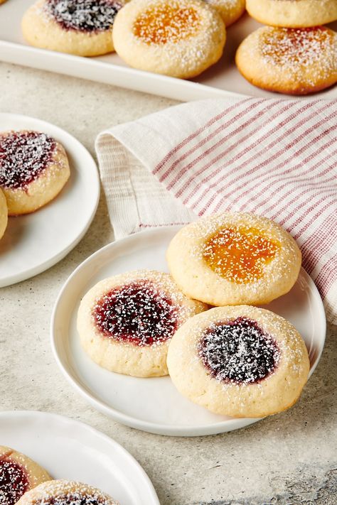 Cream Cheese Thumbprint Cookies are soft, not too sweet cookies filled with your favorite fruit jam. Perfect for spring, the holidays, or just because! Flower Jam Cookies, Cream Cheese Cookies With Jam, Apple Thumbprint Cookies, Jelly Cookies Thumbprint, Cream Cheese Thumbprint Cookies, Cheese Thumbprint Cookies, Thumbprint Cookies With Jam, Jam Thumb Print Cookies Recipes, Almond Flour Jam Thumbprint Cookies