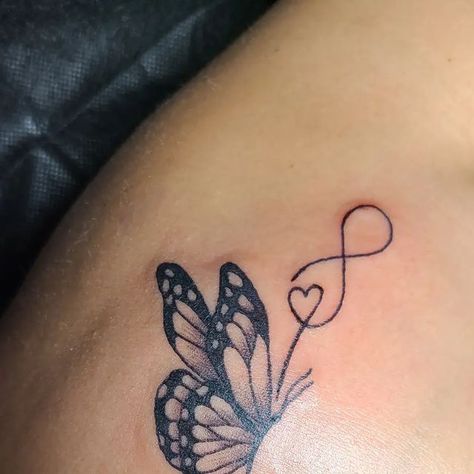 Soyla Santos on Instagram: "Butterfly with infinity symbol on the shoulder. #pretty #tattoo #love #Butterfly #infinity #ArlingtonTx" Butterfly Tattoo With Infinity Sign, Butterfly Tattoo Infinity Design, Butterfly And Infinity Tattoo, Meaningful Tattoos For Lost Loved Ones Butterfly, Butterfly Tattoo With Initials Inside, Butterfly Tattoo For Passed Loved Ones, Butterfly Infinity Tattoo, Butterfly Tattoo For Lost Loved One, Love Infinity Tattoo