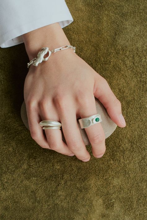 Silver rings and a silver bracelet by Dunton Ellerkamp, handmade in Brooklyn. #handmadejewelry #genderneutraljewelry #sterlingsilver #elegantjewelry #emeraldring #emeraldstone #coral #oceanicjewelry #oceaninspiredjewelry #brooklynjewelry #artisanjewelry Dunton Ellerkamp, Neutral Jewelry, Ocean Inspired Jewelry, Lost Wax Casting, Emerald Stone, Emerald Ring, Elegant Jewelry, Artisan Jewelry, Ring Designs