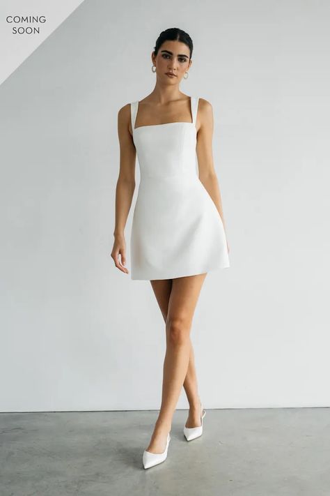 The Camille dress is the perfect sleek and chic little white dress. With clean lines, and a flirtatious mini silhouette, she’ll take you from your bridal shower, to your bachelorette party, all the way to your wedding after party. White Bridal Cocktail Dress, White Linen Mini Dress, Wedding Dresses Elopement, White Cocktail Dress Wedding, Bridal Rehearsal Dinner Outfit, Mid Length White Dress, Mini Reception Dress, Midi Length Wedding Dress, Elegant Bachelorette Party