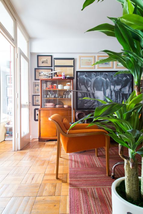 House Tour: A Designer's Small Eclectic D.C. Home | Apartment Therapy Orange Chairs Living Room, Money Secrets, Orange Chairs, Galley Wall, Midcentury Interior, Orange Chair, Vintage Chair, Shower Units, Living Room Flooring