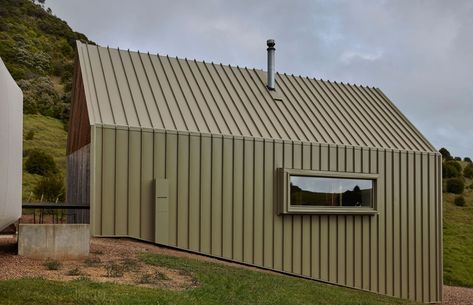 Awaawaroa House by COLORSTEEL® | ArchiPro NZ Waiheke Island, Matte Paint, Small Buildings, Beach House Design, Rustic Colors, Glazed Door, Paint Finish, Wall Cladding, Outdoor Rooms