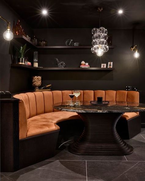 Dark Bar Interior, Corner Banquette Seating Dining Room, Kitchen Corner Booth, Booth Seating Design, Curved Banquette Seating, Bar Booth, Chandelier Dark, Dark Bar, Booth Seating In Kitchen