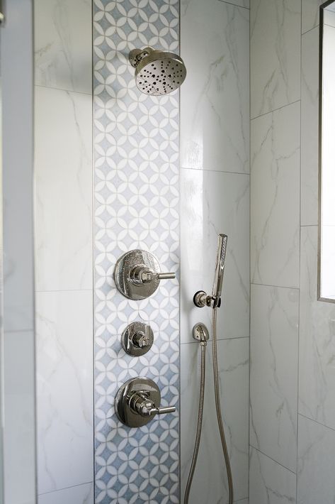 Adding an accent tile to your shower can elevate the space in ways you never expected. It's a pleasant surprise and adds a level of luxury to the space! There are so many tile options waiting for you, and two of our favorites are marble and zellige.