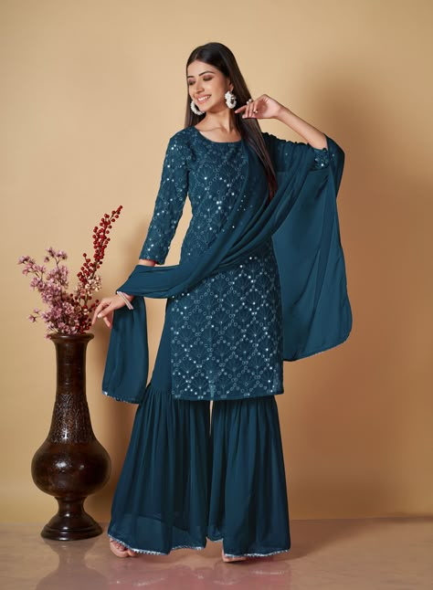 Party Wear Embroidery Worked Kurta With Sharara And Duppata Set Top Details : Shape :Round Work :Embroidery Worked & Sequnce Work Color :Navy Blue Fabric :Georgette Bottom Details : Style :Sharara Fabric :Georgette Color :Navy Blue Dupatta Details : Length :2.10 MTR Fabric :Georgette Color :Navy Blue Wash Care :Dry Clean Weight :700 Sharara Designs Party Wear, Georgette Salwar Suit, Women's Party Wear, Blue Sharara, Embroidery Kurti, Sharara Designs, Georgette Dupatta, Salwar Dress, Salwar Designs