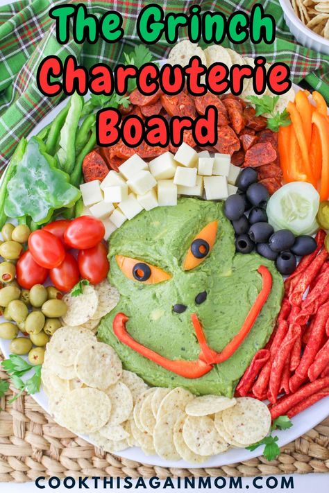 This Grinch Charcuterie Board appetizer tray will make everyone smile! Guacamole, cheese, chorizo, and chips come together in a festive way. Grinch Guacamole And Chips, Grinch Appetizers Food Ideas, Grinch Themed Charcuterie Board, Christmas Guacamole, The Grinch Charcuterie Board, Grinch Charcuterie, Grinch Board, Grinch Guacamole, Grinch Charcuterie Board Ideas