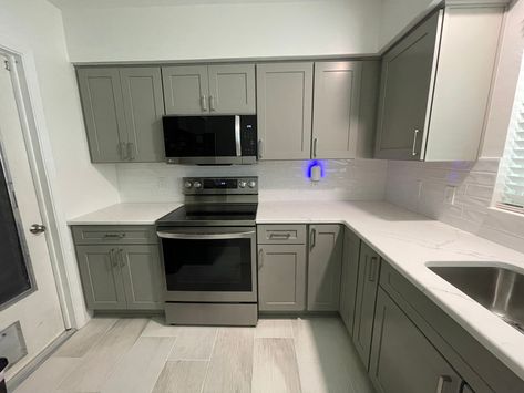 The cabinets were done in the Catalina door in birch and a pebble grey color. Pebble Grey, Grey Kitchen Cabinets, Transitional Kitchen, Grey Cabinets, Grey Kitchens, Kitchen Cupboard, Kitchen Remodel Ideas, Grey Kitchen, Kitchen Remodel Idea