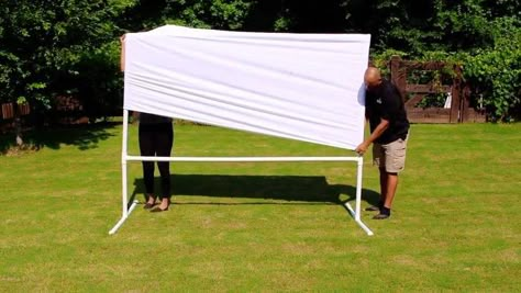 Make your very own outdoor movie theatre. This DIY PVC Pipe Movie Projector Screen is very easy to make, and great for FUN movie nights with your friends, and family. EASY as 1,2,3!!! You're going to need (4) 1 1/2in X10FT PVC Pipes, (6) 1 1/2 in Tees, (2) 1 1/2in Elbows, (4) 1 1/2in Caps(Optional), & a King Size King Sheet. Fold Sheet in Half. Use a 8Ft Pipe (Top of Screen) with attached Elbows to measure the Width of the Screen. Cut excess Material. Glue the Left &… Diy Backyard Movie Theater, Diy Backyard Movie, Diy Outdoor Movie Screen, Backyard Movie Theaters, Outdoor Movie Theater, Outdoor Movie Screen, Backyard Movie Nights, Outdoor Projector, Backyard Movie