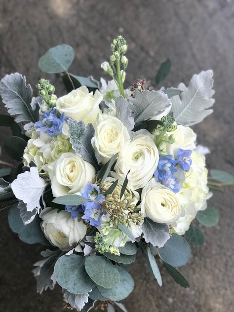 Ivory blooms accented with light blue and silver/gray tones. Light Blue And Silver Bouquet, Blue White And Silver Floral Arrangements, Wire Teapot, Blue Wedding Flower Arrangements, Blue Wedding Flowers Bouquet, Ivy Wedding, Homecoming Flowers, Gold Wedding Flowers, Ivory Bouquet Wedding