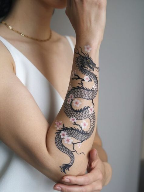 The 20 Most Stunning Asian Dragon Tattoos That Will Leave You Speechless Wrapped Dragon Tattoo, Japanese Arm Tattoos For Women, Asian Dragon Tattoo For Women, Chinese Dragon Tattoos For Women, Dragon Tattoo Wrapped Around Arm, Dragon Tattoo Neck, Dragon Tattoo Chinese, Dragon Arm Tattoo, Phoenix Back Tattoo