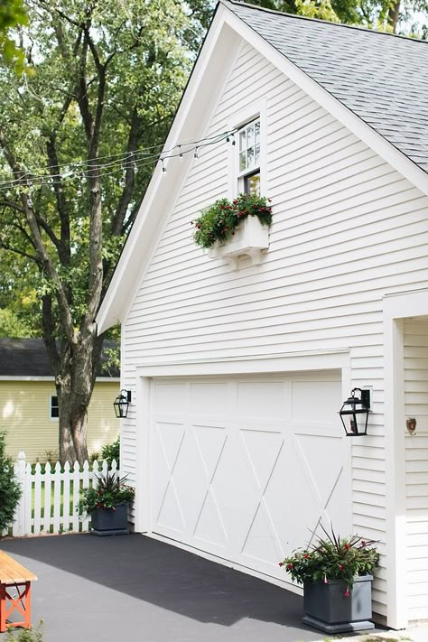 Benjamin Moore White Dove siding House and detached garage are painted Benjamin Moore White Dove #BenjaminMooreWhiteDove Detached Garage Paint Colors, White House White Garage Door, White Detached Garage, Bm White Dove Exterior, Benjamin Moore White Dove Exterior, White Dove Exterior House, White Dove Exterior Paint, Home Exterior Landscaping, White Dove Exterior