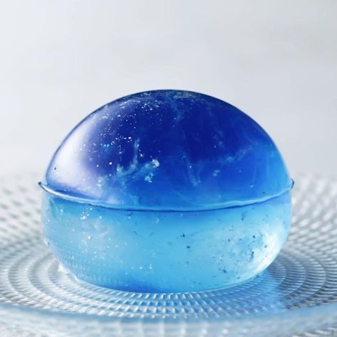 Galaxy Clear Jelly Cake Recipe by Tasty Rain Drop Cake, Raindrop Cake, Showstopper Dessert, Drop Cake, Jelly Cakes, Clear Cake, Chandelier Cake, Buckwheat Cake, Strawberry Syrup