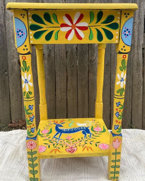 💫Add a touch of whimsy to your home with this unique hand-painted folk art side table. This one-of-a-kind piece features vibrant colors and intricate designs, making it a standout accent in any room. Crafted with care and creativity, this table is not just furniture; it's a conversation starter. Elevate your space with a blend of craftsmanship and artistic expression. 💫Acrylic on wood- sealed with sealant Hippy Painted Furniture, Mexican Inspired Painted Furniture, Mexican Painted Table, Artistic Side Table, Folk Art Stool, Whimsical Side Table, Colorful Wood Furniture, Wood Furniture Painting Ideas, Folk Art On Furniture