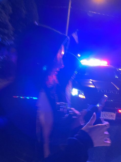 silhouette of two brunette girls in front of a police car during 4th of july. blue lighting Police Cars Aesthetic, Cop Lights At Night, Cop Cars At Night, Police Snapchat Story, Police Fake Story, Cops Aesthetic, Police Station Snap, Police Lights Night, Pulled Over By Cop