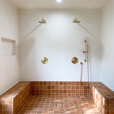 Zia Tile on Instagram: “Want a winning combination? The natural tones of our 🖐 made Fired Earth 4x4 Cotto pair PERFECTLY with the muted, softly organic texture of…” Terracotta Shower Room, Zia Tile Cotto, Creative Tile Ideas, Cle Tile Fireplace, Cotto Tiles Bathroom, Terracotta Shower Tile, Woodshop Interior, Terracotta Tile Bathroom, Cotto Tile