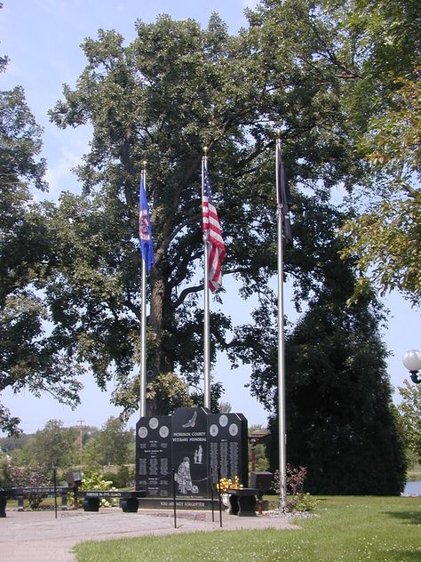 Veterans Memorial Park in Little Falls, MN pays tribute to the veterans in Morrison County. People can pay their respects at this stunning park that blooms beautiful flowers from its place alongside the Mississippi River. Veterans Memorial, Memorial Park, Memorial Garden, Mississippi River, Outdoor Fun, Mississippi, Future House, Flower Garden, Beautiful Flowers