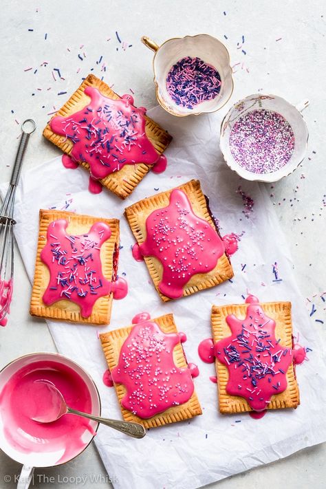 Raspberry Glazed Gluten Free Pop Tarts - With naturally dyed vibrant pink frosting, these raspberry glazed gluten free pop tarts are as pretty as they are delicious! Plus, they’re super easy to make. Gluten free dessert recipes. Homemade pop tarts. Raspberry pop tarts. Pop tart recipe. Gluten free pie crust. Easy dessert recipes. Pop tarts flavors. Pie recipes. Easy recipes. #glutenfree #dessert #recipe #poptarts Raspberry Pop Tarts, Gluten Free Desserts Cookies, Gluten Free Pop Tarts, The Loopy Whisk, Loopy Whisk, Pop Tart Flavors, Poptart Recipe, Crumble Pie, Gluten Free Pie Crust