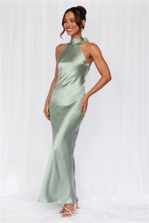 Length from neck to hem of size S: 142cm. 
 Chest: 36cm, Waist: 34cm, across front only of size S. 
 Maxi dress. 
 Lined. 
 Model is a standard XS and is wearing size XS. 
 True to size. 
 Non-stretch. 
 Luxurious satin. 
 Halter tie neckline. 
 High neck. 
 Elastic back. 
 Vent extension. 
 Straight, flowy silhouette. 
 Zipper with hook eye closure.  
 Cold hand wash only. 
 Polyester. 
 This material is very delicate. Please handle with care. 
 Please Note: This product is a Exclusive.  
 
 St Dress Sage, Styl Glamour, Camisole Dress, Maxi Dress Wedding, Satin Maxi, Satin Maxi Dress, Green Satin, Outfit Summer, Shop Maxi Dresses