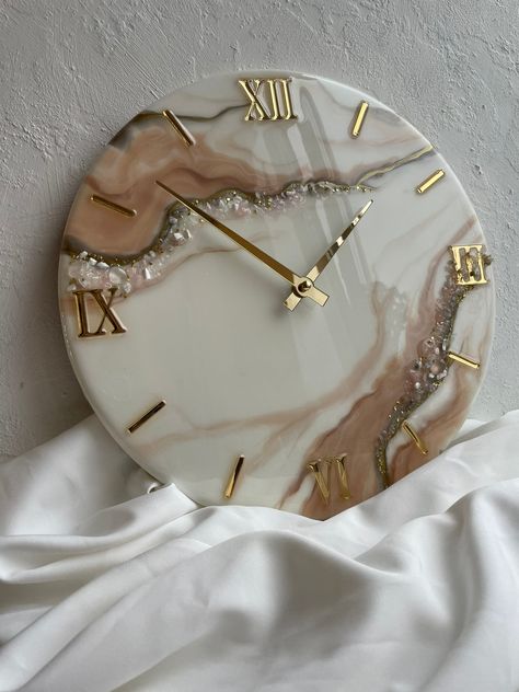 This elegant geode epoxy wall clock will be a great decoration for your bedroom, living room, office and kitchen. Will please your friends and relatives on a wedding, birthday, anniversary, housewarming and any other holiday. Geode made of premium quality epoxy resin, decorated with stones.  It is possible to create a picture according to your preferences. You can also order a picture in a different size and color. For more details, write to me  :) I will be happy to help you Epoxy Resin Pictures Ideas, Resin Art Wall Clock Design, Geode Clock Resin, Resin Wall Clock Ideas, Wall Resin Art, Resin Room Decor, Resin Art Wall Decor, Epoxy Clock Design, Epoxy Resin Clocks