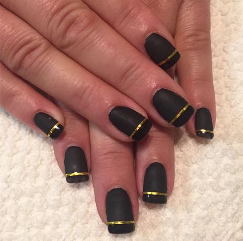 Black nails with gold stripes Black Nails With Gold French Tip, Nails With Gold French Tip, Black Nails With Gold, Gold French Tip, Black Gold Nails, Nails With Gold, Matte Black Nails, Neutral Nails, Gold Stripes