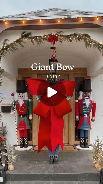 Bows On Front Porch Lights, Wreath On Lamp Post, Christmas Decor Ideas Ballons, Giant Christmas Wreath On House, Holiday Bow Decor, Bow On Front Door Christmas, Large Front Window Christmas Decor, Red Bow Front Door Christmas, Christmas Bows On Outdoor Lights