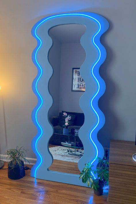 LED mirror. Blue home decor. Colorful home aesthetic. Home inspo. Wavy mirror. Funky Bedroom Mirror, Mirror Maximalist, Wiggly Mirror Aesthetic, Funky Full Body Mirror, Colorful Full Body Mirror, Curvy Mirrors, Living Room Decor Colorful, Funky Apartment Decor, Pastel Room Aesthetic