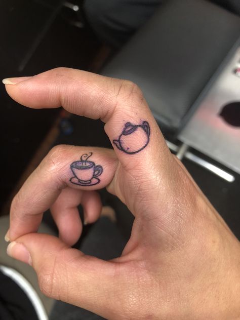 Tiny Coffee Mug Tattoo, Coffee Cup Finger Tattoo, Tea Related Tattoos, Teapot Tattoo Simple, Coffee Mug Tattoo Ideas, Teapot And Teacup Matching Tattoo, Coffee Finger Tattoo, Hot Tea Tattoo, Tiny Teapot Tattoo