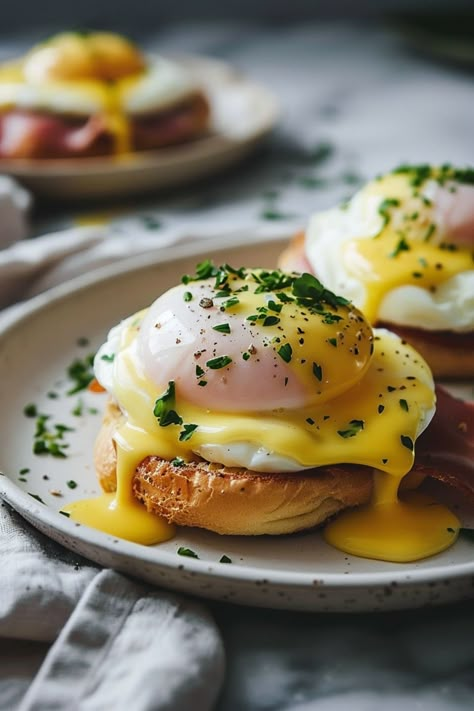 Looking for the perfect brunch recipe? Try our delicious eggs benedict recipe today! Treat yourself to fluffy poached eggs, crispy bacon, and creamy hollandaise sauce. This classic dish is sure to impress your friends and family. Whether it's a special occasion or a lazy weekend morning, eggs benedict is always a good idea. Follow our step-by-step instructions to create the ultimate breakfast indulgence that will leave everyone coming back for more. Egg Benedict Sandwich, Classic Eggs Benedict, Hollandaise Breakfast Ideas, Poached Eggs Recipe Breakfast, Eggs Benedict With Bacon, Poached Egg Dishes, Food That Looks Good, Winter Brunch Recipes, Best Eggs Benedict Recipe