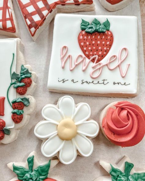 Custom design cookies in a strawberry theme. Berry Sweet Cookies Decorated, Strawberry Decorated Cookies, Strawberry Theme Cookies, Strawberry Cookies Decorated, Strawberry 1st Birthday Party Theme, Berry First Birthday Cookies, Birthday Strawberries, Daisy Cookies, Berry Party