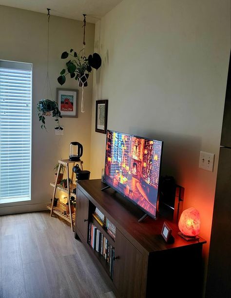 By putting your book library under your smart TV in the living room, you can enjoy the convenience of having both entertainment and reading materials in one central location, save space in your living room, enhance the decor, keep the living room organized, and utilize the space for multiple purposes. Cozy Tv Stand, Books Under Tv, Tv Set Up Bedroom, Tv Setup Living Room, Tv Stand And Panel, Tv Set Up, Tv Setup, Apartment Stuff, Reading Materials