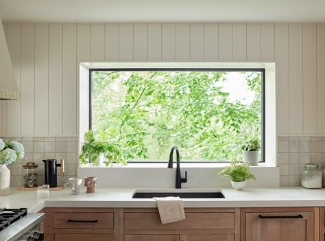 With direct sunlight and added space for plants and décor, garden windows bring greenhouse vibes to brighten up any room. Explore modern garden windows. Kitchen With Garden Window, Window Below Kitchen Cabinets, Panoramic Kitchen Window, Oversized Kitchen Window, Kitchen Sink Near Window, Kitchen Window Frame Over Sink, Kitchen Window Remodel, Picture Window Kitchen Sink, Small Kitchen Big Window