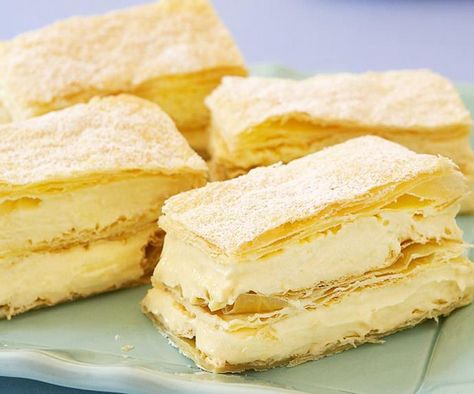 Creamy vanilla custard and layers of light pastry dusted with icing sugar, a piece of French vanilla slice is a perfect afternoon treat, especially with a cup of good coffee on the side. Vanilla Slice Recipe, Vanilla Slice, Custard Slice, Slice Recipe, Puff Pastry Dough, Custard Powder, Food Network Canada, Slices Recipes, Vanilla Custard