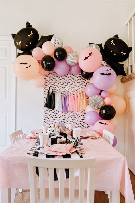 Pink And Black Halloween Balloon Garland, Pink Pastel Halloween Party, Cute Spooky Birthday Party, Pink Halloween Birthday Party Decor, Pink And Purple Halloween Party, Bat Birthday Party, Pastel Halloween Birthday Party, Pink Halloween Baby Shower Ideas, October First Birthday