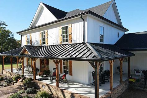 Black Metal Roof Farmhouse White Siding, Metal Roof Covered Patio, Tin Roof Front Porch Addition, Metal Roof Historic Home, Metal Roof On Porch, Metal Covered Porch, Grey Steel Roof, Painting A Tin Roof, White House With Copper Metal Roof