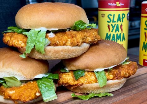 Looking to add some heat to your classic fast food sandwich? Try this recipe for a spicy twist on the McDonald's McChicken sandwich, featuring the flavorful Slap Ya Mama Seasoning and Wing Sauce. With a crispy coating and a juicy chicken patty, this sandwich is sure to satisfy your cravings for both crunch and spice. Slap Your Mama Recipes, Slap Ya Mama Chicken, Spicy Mcchicken, Slap Ya Mama Seasoning, Fast Food Sandwich, Slap Ya Mama, Chicken Patty, Buffalo Chicken Sliders, Spicy Chicken Sandwiches