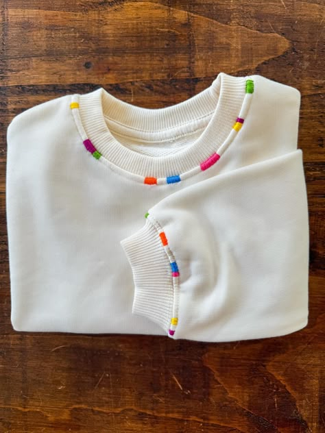 This high quality personalized hand embroidered sweatshirt is the perfect thing for back to school and cooler weather! All work is done by hand, so some variation is expected in your custom piece. Cozy, warm, and cute, these are ideal for your little one! Color options for this sweatshirt are basically endless. I am happy to work with you on a custom color palette.Please include the color palette you would like or up to 8 custom colors. NOTE- any information left out of personalization details may cause your order to be delayed Sweatshirt Designs Embroidery, Sweatshirt Cuff Embroidery, Upcycle With Embroidery, Words To Embroider, Sweatshirt Collar Embroidery, Hand Sewn Sweatshirt, Embroidered Collar Sweatshirt, Embroidered School Sweatshirt, Hand Embroidery Crewneck