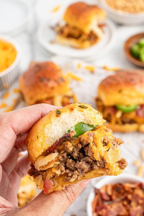 hand holding a Cowboy Slider. Cowboy Butter Sliders, Cowboy Sliders Recipe, Cajun Sliders, Cowboy Sliders, Slider Ideas, Cowboy Recipes, Ground Beef Sliders, Sloppy Joes Sliders, Hamburger Sliders