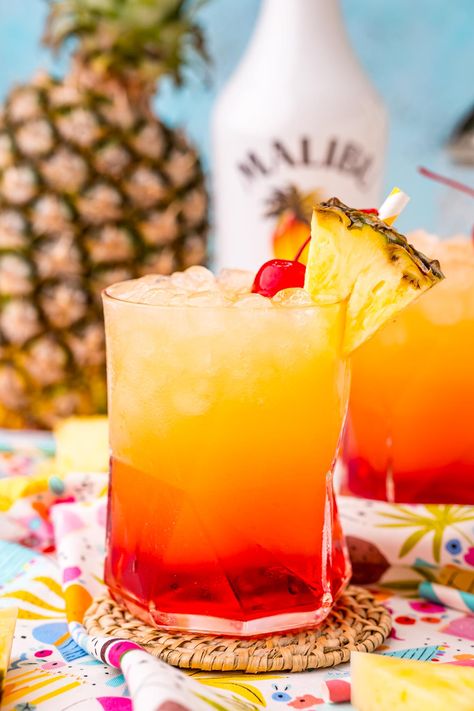 Malibu Sunset Drink is a tropical cocktail made with pineapple juice, coconut rum, and homemade grenadine syrup for the perfect summer drink! Malibu Sunset Cocktail Recipe, Sunset Drink Recipe, Sunset Cocktail Recipe, Homemade Grenadine, Rum Drinks Recipes, Malibu Drinks, Sunset Restaurant, Sunset Drink, Malibu Sunset