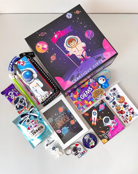 🚀Space-themed Rakhi Hamper for Lil Bro👨‍🚀 To the 🌜& 🔙 with love! Our rakhi hamper is out of this world, just like your younger brother. 🎁🧿 This beautiful box comes with the following goodies- • Pencil Box • Diary • Customizable Frame • 2-in-1 Rakhi • Keychain • Badge • Pen & Pencil • Eraser • Hand Band • Stickers • Hershey’s Kisses • Cadbury Gems • Crispello Price: ₹1999/- + shipping DM us to place your order 💌 No COD [Gift hampers, rakhi gifts, rakhi hampers, rakhi gifts2024, rakhi f... Cadbury Gems, Rakhi Hampers, Hand Band, Lil Bro, Band Stickers, Younger Brother, Pencil Box, Pencil Eraser, Pencil Boxes