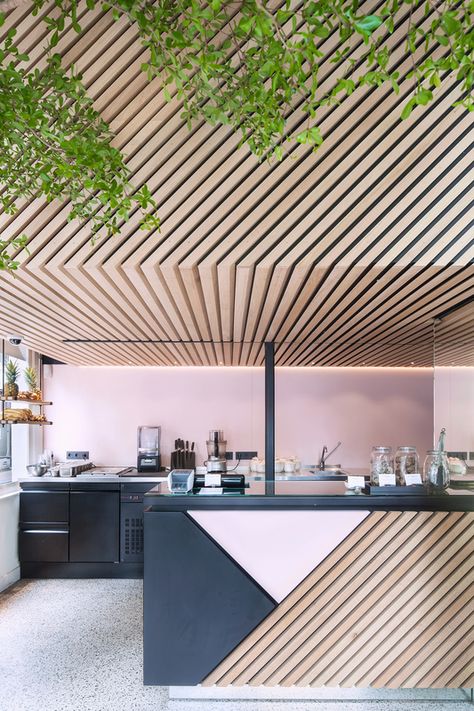 Designed by Standard Studio, the graphic store uses a palette of black and pink powder-coated metal and diagonally aligned wood slats. Photo by Wouter van der Sar. Amsterdam Living, Counter Design, Hospitality Design, Shop Interior Design, Wood Slats, Restaurant Interior, Shop Interior, Cafe Interior, Cafe Design